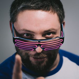 A portrait of Rob with neon spectacles